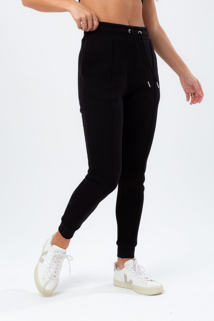 HYPE WOMENS BLACK EXPOSED OVERLOCK JUSTHYPE JOGGERS